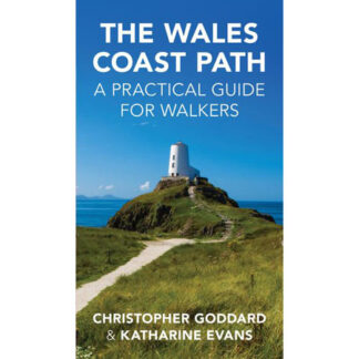 Image of a path leading to a headland with lighthouse with blue sky - front cover image of The Wales Coast Path by Christopher Goddard and Katherine Evans